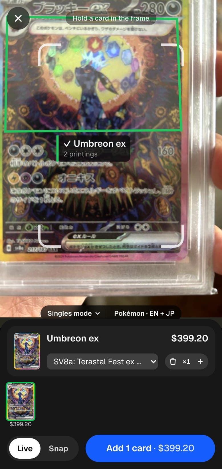 The Capyberry scanner recognising a Japanese Umbreon ex in a slab: a green box around the art, the card name, the Japanese printing selected and its price.
